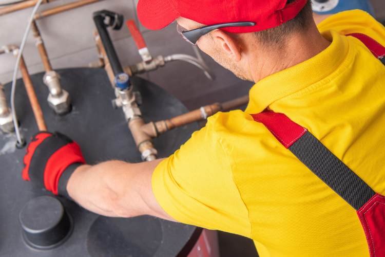 plumber fixing water heater